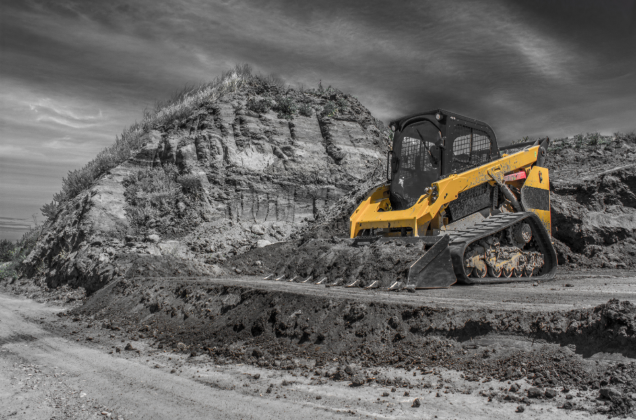 Cat track loader loading dirt in the bucket