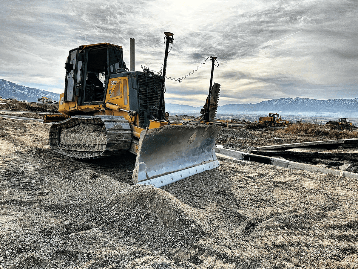 Bulldozer with steel tracks on gravel worksite